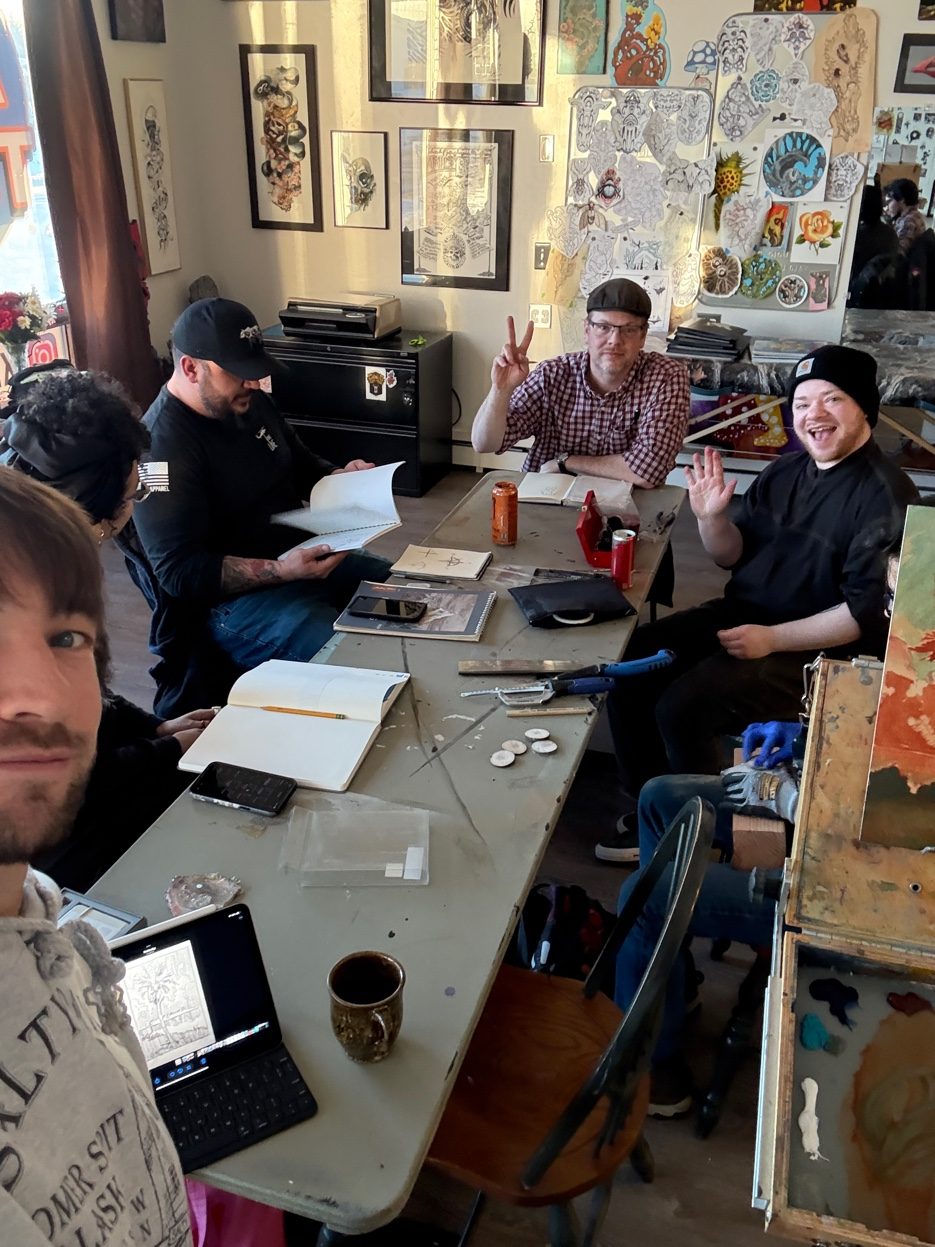 AK Tattoo Anchorage team at work — tattoo artists studio 409 W Northern Lights Blvd Alaska