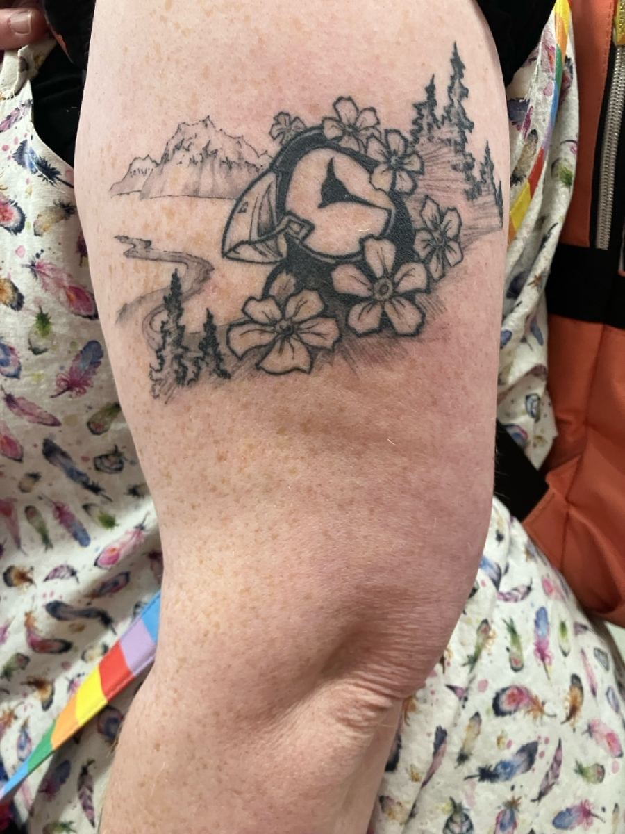 Alaska mountain landscape forget-me-nots black and grey arm tattoo — Cade Bennett Anchorage