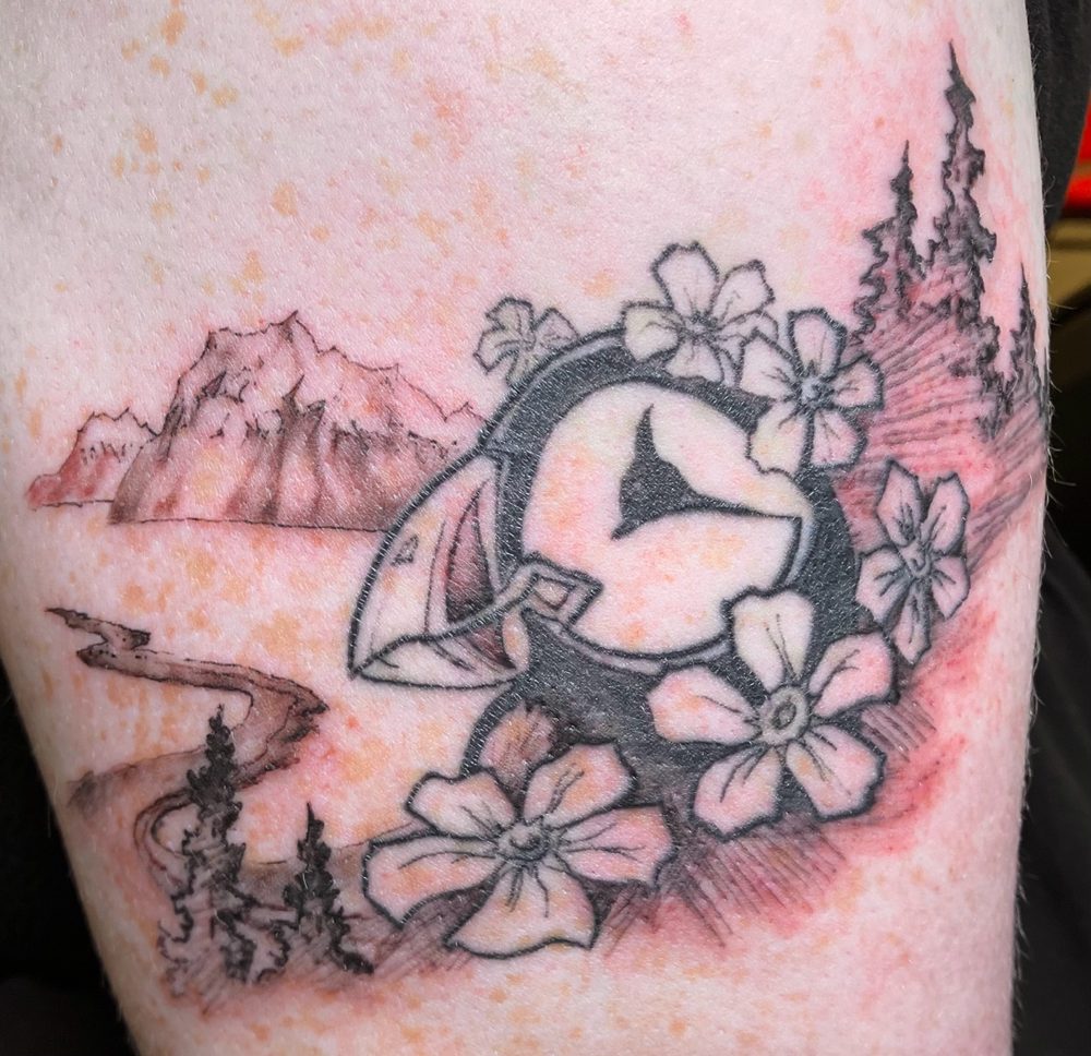 Alaska salmon and forget-me-not landscape tattoo — Cade Bennett, AK Tattoo Anchorage Alaska