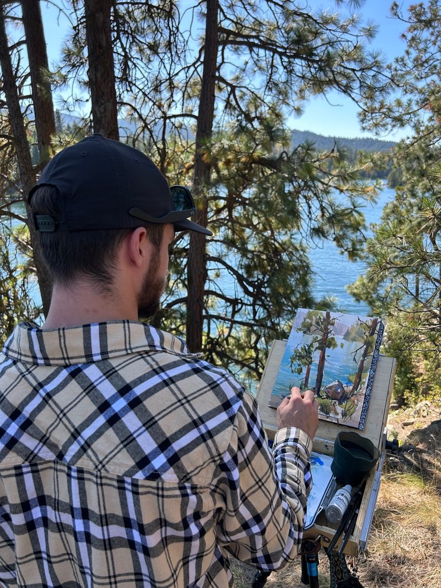 Cade Bennett painting Alaska mountain lake plein air — fine art tattoo artist Anchorage AK