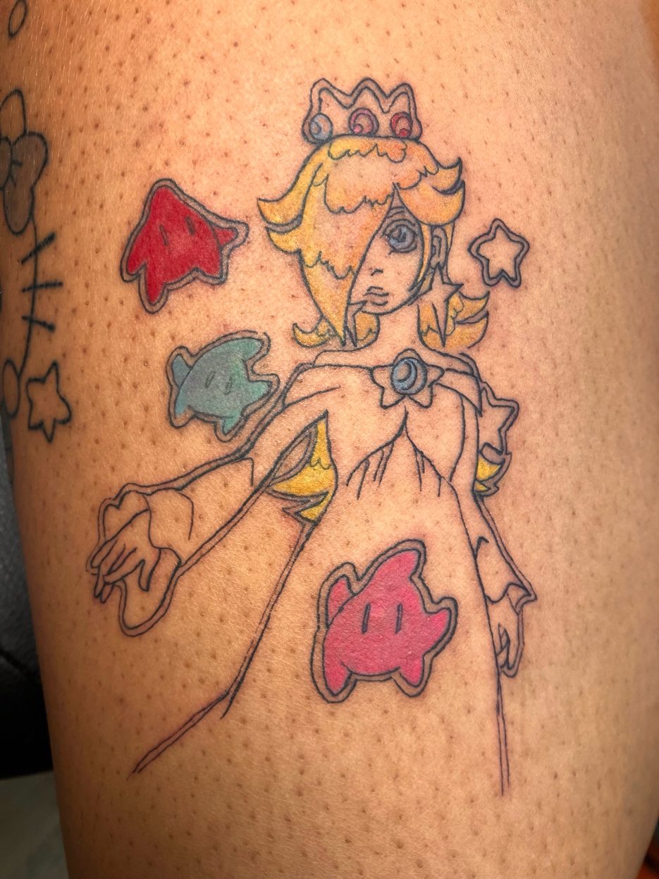 Cross and floral black and grey tattoo on arm — Cade Bennett, tattoo artist Anchorage Alaska