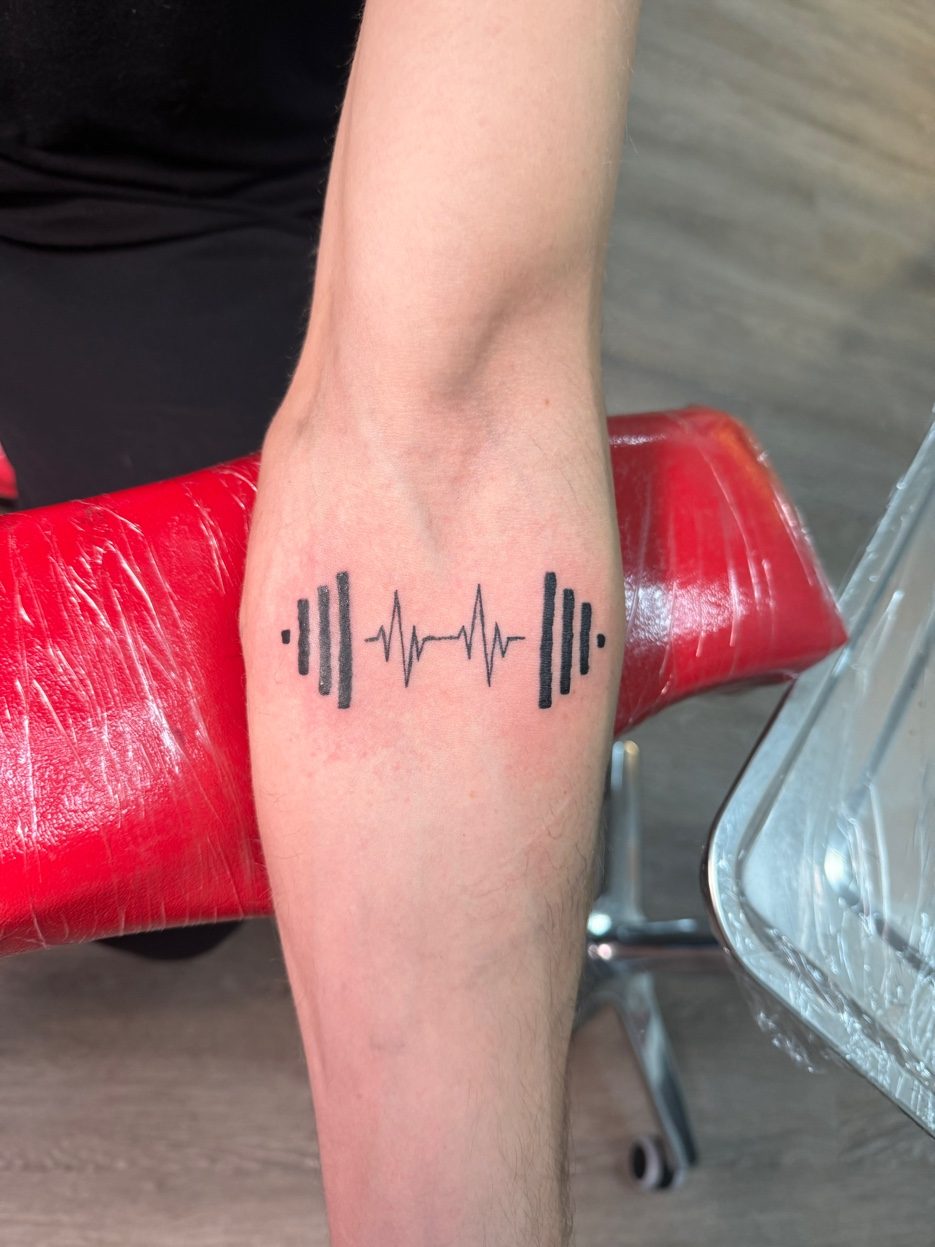 Soundwave heartbeat forearm tattoo black linework — Cade Bennett, tattoo artist Anchorage AK