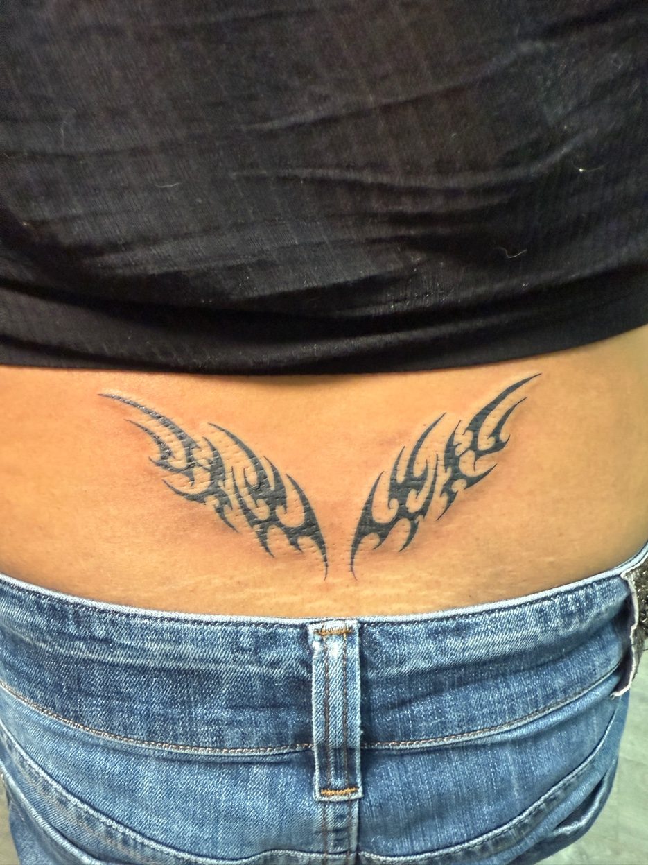 Spider Umbrella Corp forearm tattoo — Cade Bennett, custom tattoo AK Tattoo Anchorage Alaska