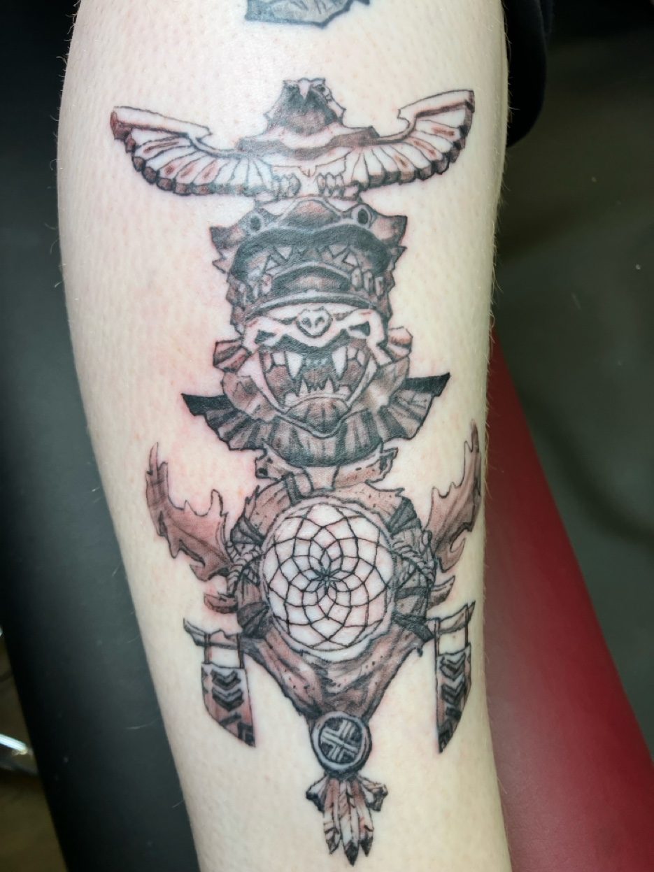 Wolf paw print Alaska mountain silhouette tattoo — Cade Bennett, tattoo Anchorage Alaska